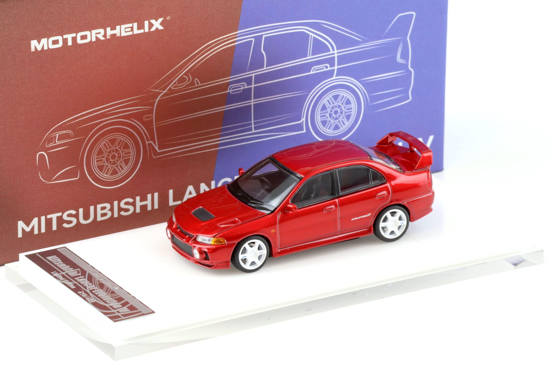 1:64 Motorhelix Mitsubishi Lancer Evolution IV Metal red + wheels HEC EXPO