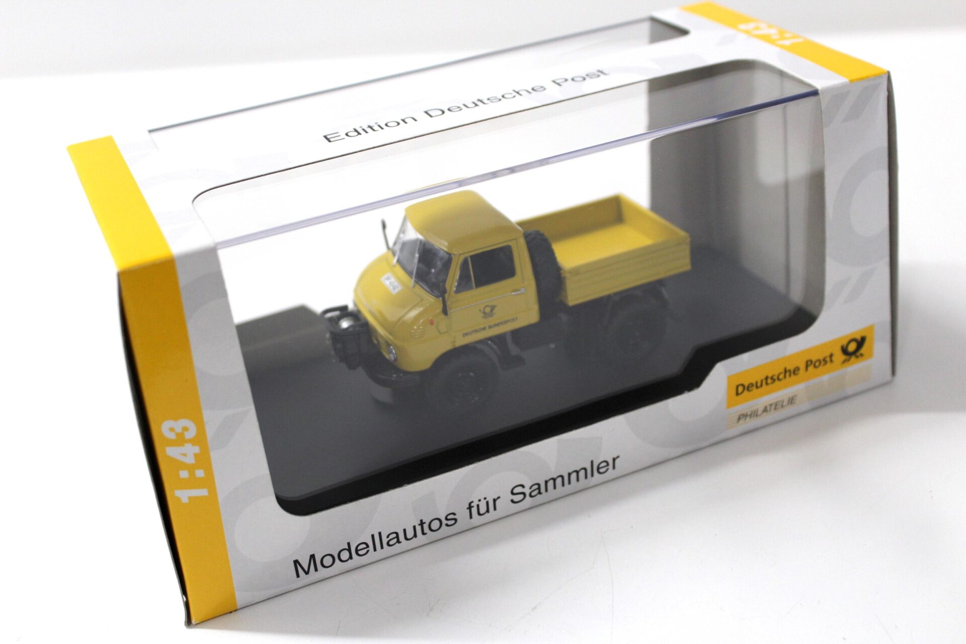 1:43 Schuco Mercedes Unimog 411 Deutsche Post yellow