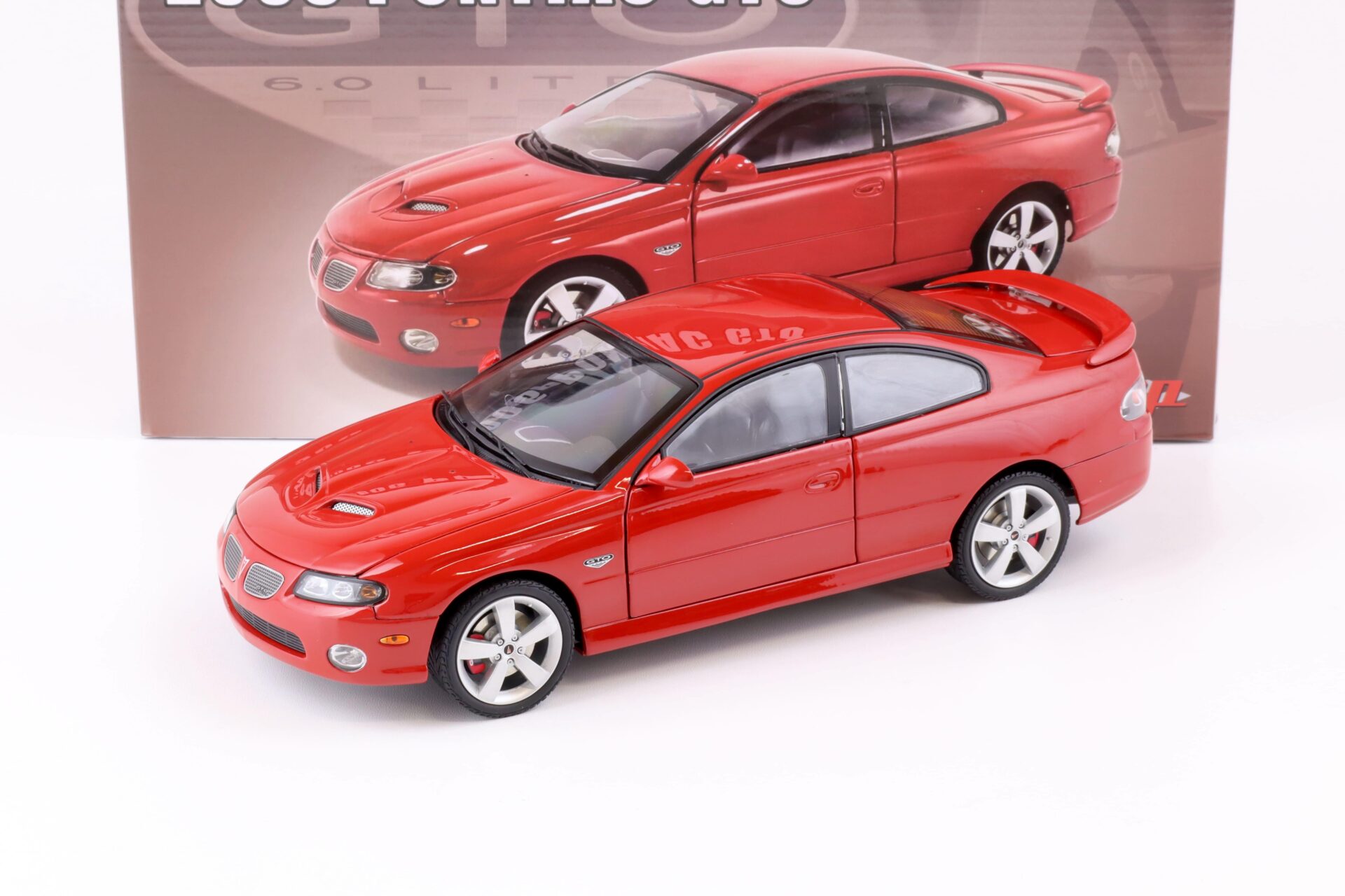 ID 75451 orig.jpg 1:18 GMP 2006 Pontiac GTO Coupe spice red with black interior 18980