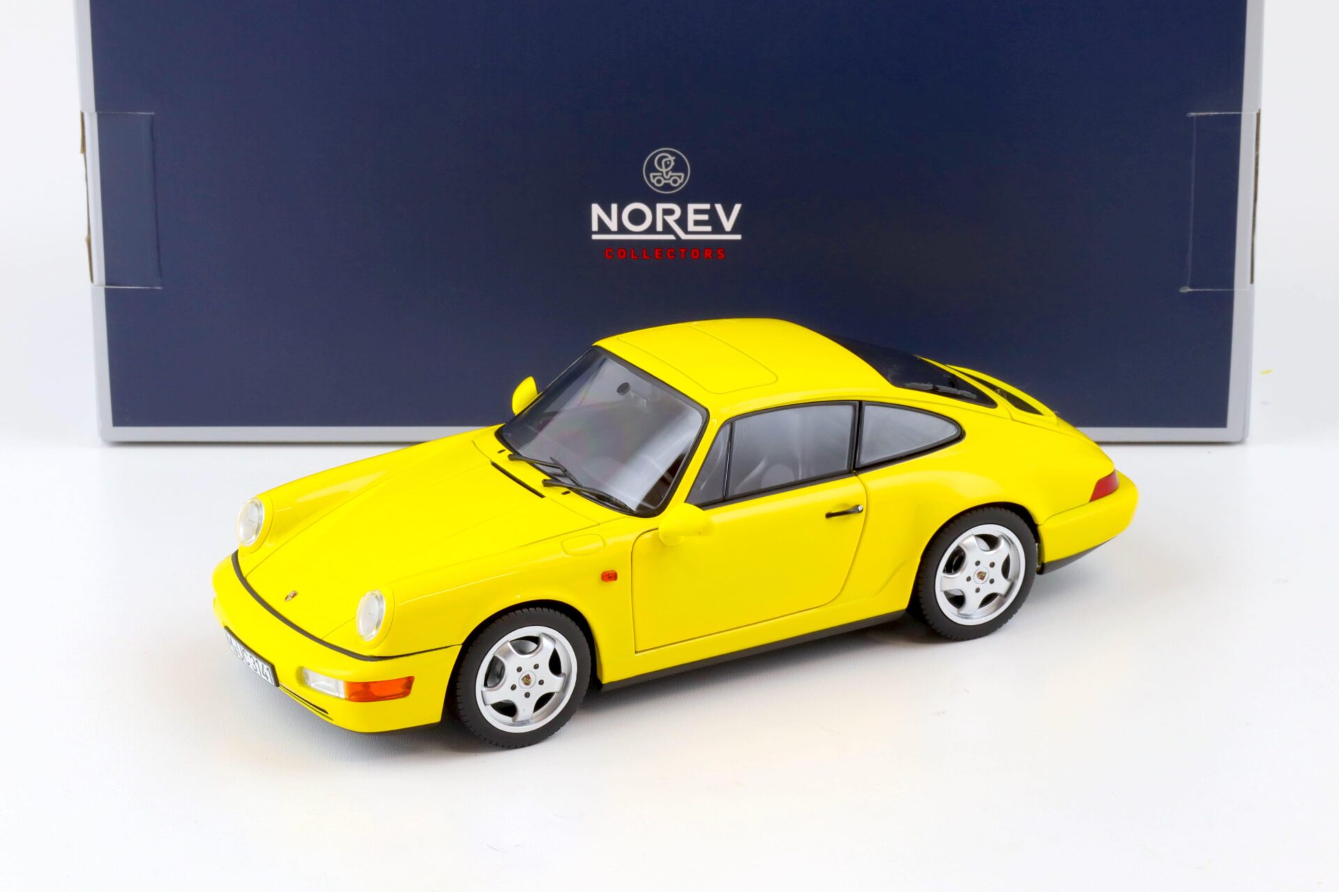 ID 80429 orig 1.jpg 1:18 Norev Porsche 911 (964) Carrera 2 Coupe 1992 yellow
